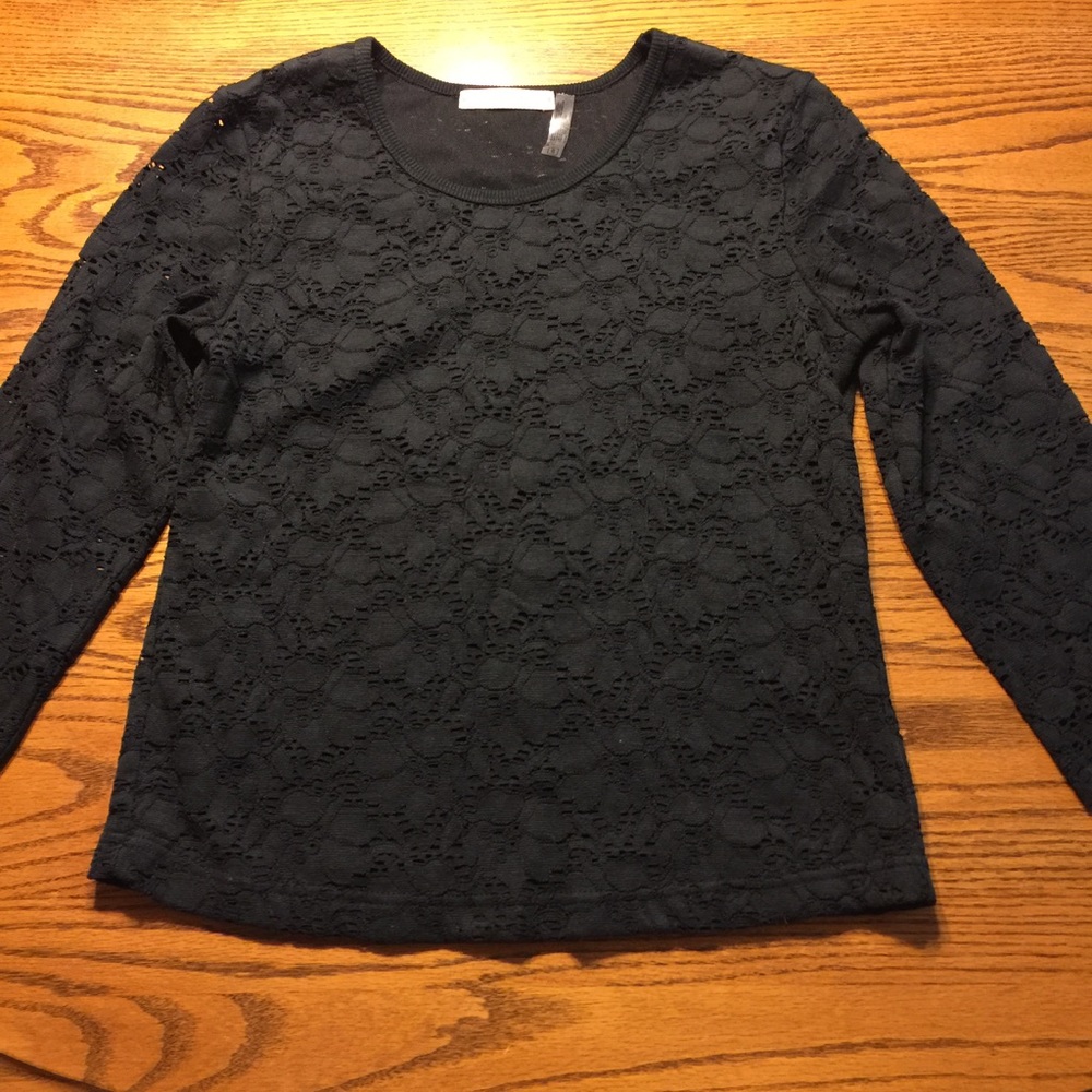 Long sleeved crocheted lace top.